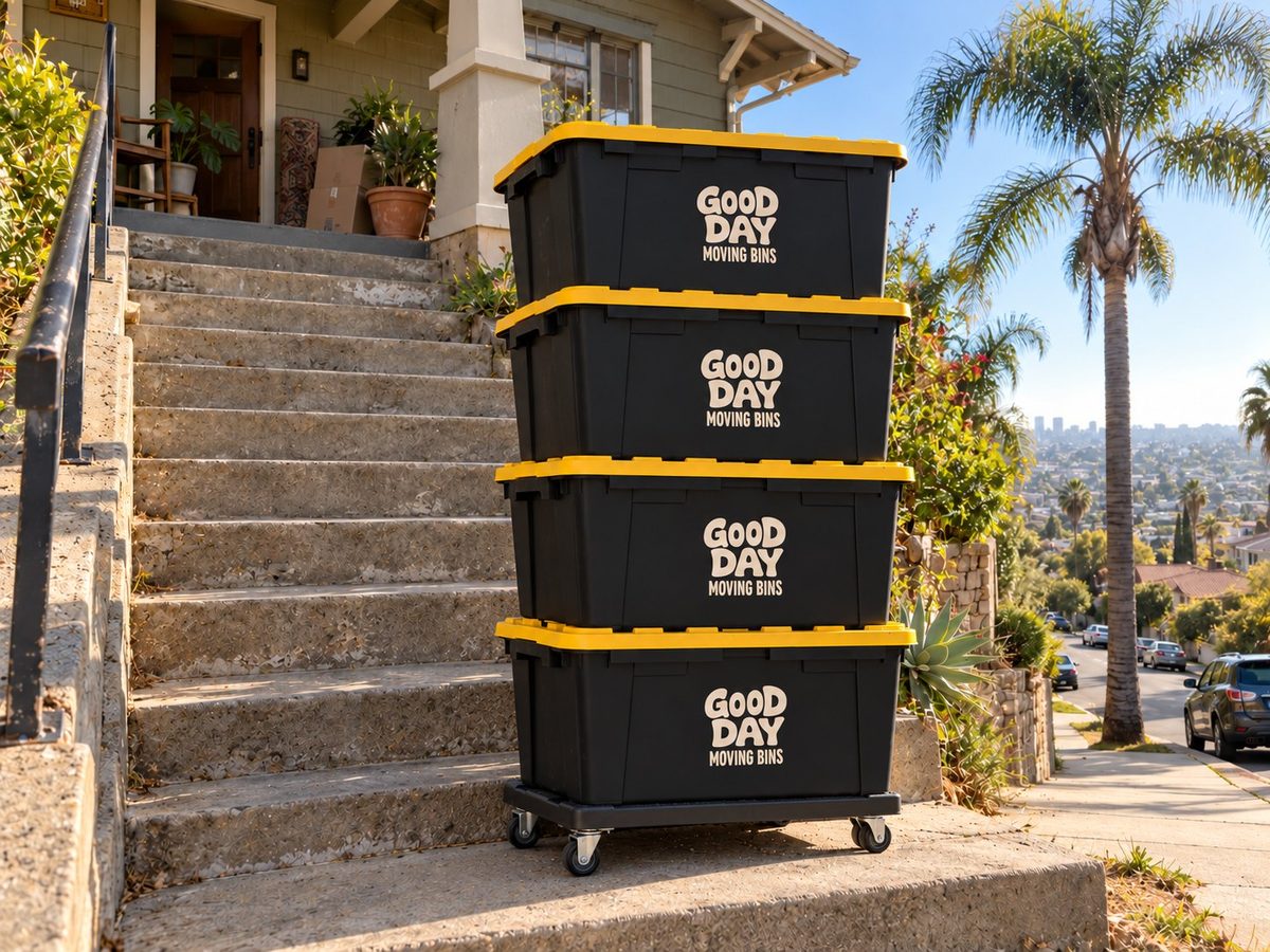 Four Good Day moving bins on a dolly at the bottom of the front steps of a hillside Golden Hill home